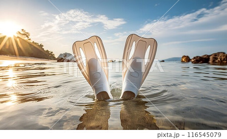 Pair of Flip Flops Poking Out of Water 116545079