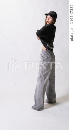 posing stylish girl jeans white female cap jacket woman braces background pure casual posing stylish girl jeans white female cap jacket woman braces background pure casual 116547389