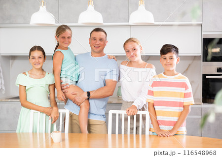 Portrait of best dad who spends his free time with cute, adorable kids in bright modern home kitchen 116548968