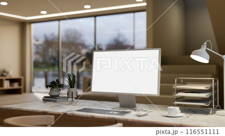A computer with a white-screen mockup on a marble table in a modern, luxurious living room. A computer with a white-screen mockup on a marble table in a modern, luxurious living room. 116551111