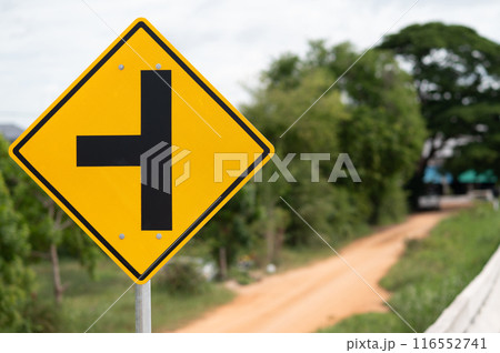 T-junction left sign is on green background.Selective focus. 116552741