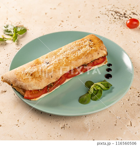 Delicious panini with juicy tomatoes and herbs Delicious panini with juicy tomatoes and herbs 116560506