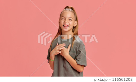 Portrait of happy child, girl in casual clothes cheerfully smiling, laughing against peach background. Happiness, celebration, joy Portrait of happy child, girl in casual clothes cheerfully smiling, laughing against peach background. Happiness, celebration, joy 116561208