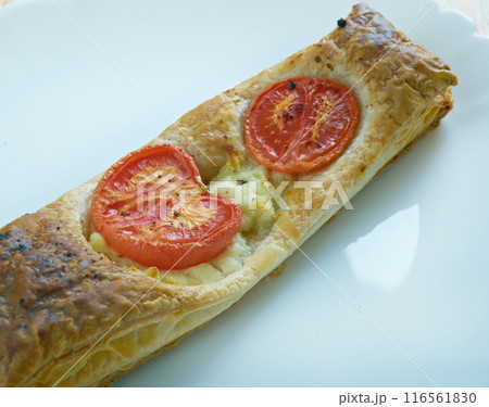 Pastry tart with cheese and tomatoes Pastry tart with cheese and tomatoes 116561830