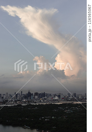Aerial view of skyscrapers and dramatic sky before sunset. 116565067