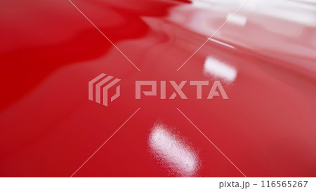 Shiny Red Plastic Surface with Light Reflections, Ideal for Backgrounds and Textures Shiny Red Plastic Surface with Light Reflections, Ideal for Backgrounds and Textures 116565267