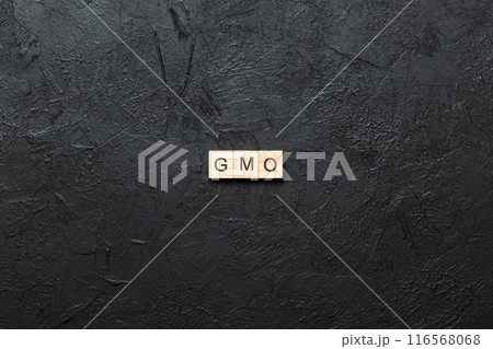 gmo word written on wood block. gmo text on table, concept 116568068