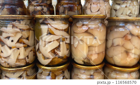 A variety of mushrooms in jars. Canned mushrooms. 116568570