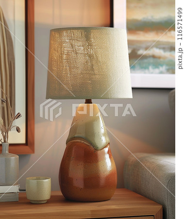 Handmade ceramic table lamp using glazed pottery material. Lampshade is made of fabric. 116571499