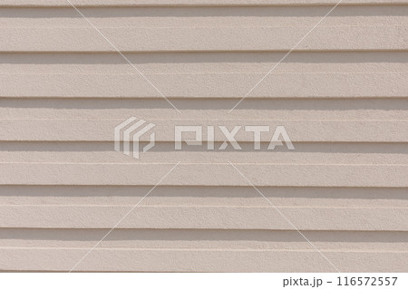 Beige Textured Wall with Horizontal Lines for Background or Architectural Design. 116572557