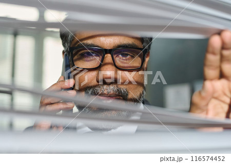 Face of mature male boss in eyeglasses 116574452