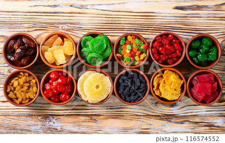 Group of dried and candied fruit in bowl 116574552
