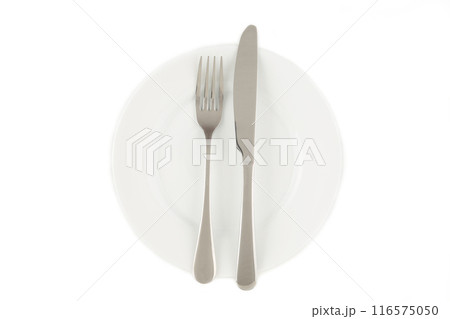 Dining etiquette - the meal is over or finished. Fork and knife signals with location of cutlery set. Photo isolated on white background. Set of foto 1 from 7 Dining etiquette - the meal is over or finished. Fork and knife signals with location of cutlery set. Photo isolated on white background. Set of foto 1 from 7 116575050