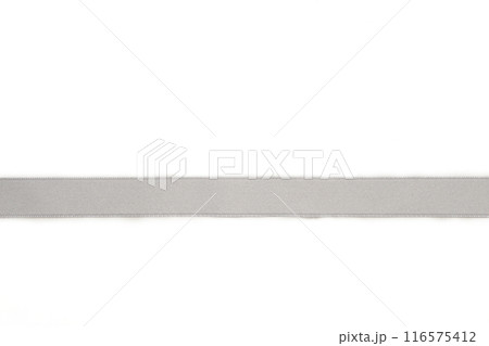 Shiny silver satin ribbon on white background 116575412