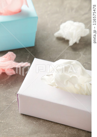 Two tissue box on grey background. Vertical foto 116575478
