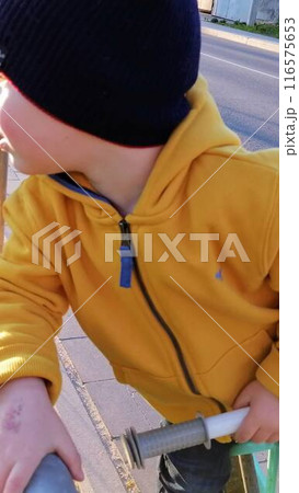 Adorable toddler boy having fun on playground Adorable toddler boy having fun on playground 116575653