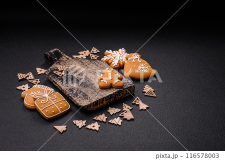 Empty wooden cutting board with Christmas decor elements Empty wooden cutting board with Christmas decor elements 116578003
