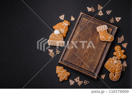 Empty wooden cutting board with Christmas decor elements Empty wooden cutting board with Christmas decor elements 116578009