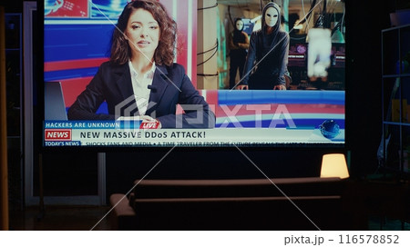 Smart TV displaying news program broadcasting with journalist talking about cybercriminals attacks subject, close up shot. Big television screen showing VOD channel with newscast coverage of hackers 116578852