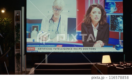 Modern TV displaying news program broadcasting with journalist talking about artificial intelligence subject, close up shot. Ultrawide television screen showing VOD journalism channel Modern TV displaying news program broadcasting with journalist talking about artificial intelligence subject, close up shot. Ultrawide television screen showing VOD journalism channel 116578858