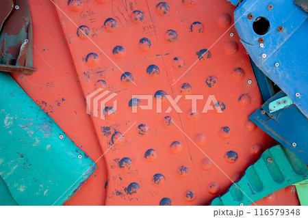 Multicolored red plastic metal waste abstract Multicolored red plastic metal waste abstract 116579348