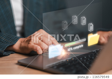 Visual representation of data backup process with progress bar and folders on a laptop screen, symbolizing digital security and data management. 116579549