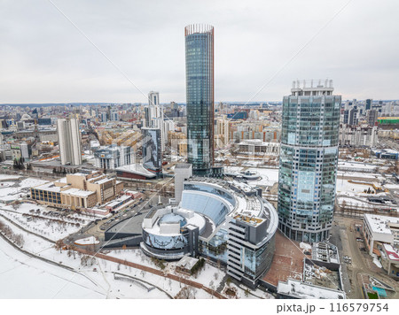 Yekaterinburg city with Buildings of Regional Government and Parliament, Dramatic Theatre, Iset Tower, Yeltsin Center, panoramic view at winter sunset. Yekaterinburg city with Buildings of Regional Government and Parliament, Dramatic Theatre, Iset Tower, Yeltsin Center, panoramic view at winter sunset. 116579754