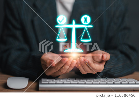 A businessman holds a digital scale of justice, symbolizing ethics, fairness, and integrity in business practices. Ideal for concepts related to law, justice, and corporate ethics. A businessman holds a digital scale of justice, symbolizing ethics, fairness, and integrity in business practices. Ideal for concepts related to law, justice, and corporate ethics. 116580450