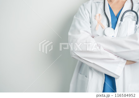 Doctor holding Peach Ribbon for September Uterine Cancer Awareness month. Uterus and Ovaries, Endometriosis, Hysterectomy, Uterine fibroids, Reproductive, Healthcare and World cancer day concept Doctor holding Peach Ribbon for September Uterine Cancer Awareness month. Uterus and Ovaries, Endometriosis, Hysterectomy, Uterine fibroids, Reproductive, Healthcare and World cancer day concept 116584952