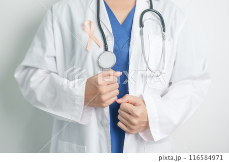 Doctor holding Peach Ribbon for September Uterine Cancer Awareness month. Uterus and Ovaries, Endometriosis, Hysterectomy, Uterine fibroids, Reproductive, Healthcare and World cancer day concept 116584971