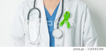 Doctor with green Ribbon for world Lymphoma Awareness September month, world Mental Health Day, Liver, Gallbladders, bile duct, cervical, kidney Cancer. Healthcare and world cancer day concept 116585109