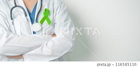 Doctor with green Ribbon for world Lymphoma Awareness September month, world Mental Health Day, Liver, Gallbladders, bile duct, cervical, kidney Cancer. Healthcare and world cancer day concept 116585110
