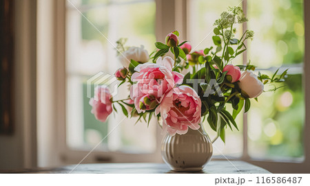 Beautiful bouquet of flowers in a vase. Floral arrangement 116586487