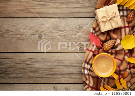 Hot coffee and autumn leaves on grey wooden background - seasonal relax concept 116586801
