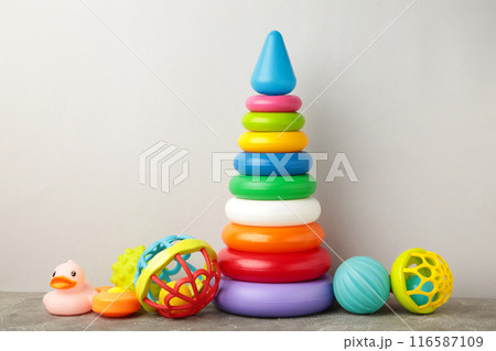 Toys collection for baby on grey background Toys collection for baby on grey background 116587109