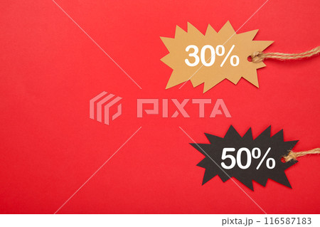 Two sale tags on red background with copy space. Black friday Two sale tags on red background with copy space. Black friday 116587183