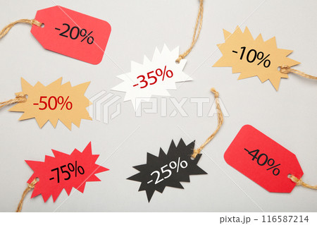 Sale tags with percent on grey background. Black friday 116587214