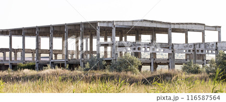 old USSR factory exterior, industry building is in a state of disrepair old USSR factory exterior, industry building is in a state of disrepair 116587564
