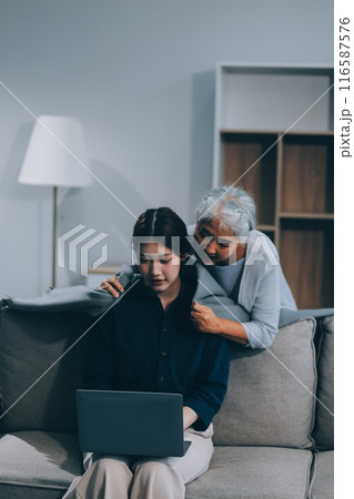 Asian elderly women and friend using social media and living room. Video streaming, happiness and conversation at a house with old people together 116587576