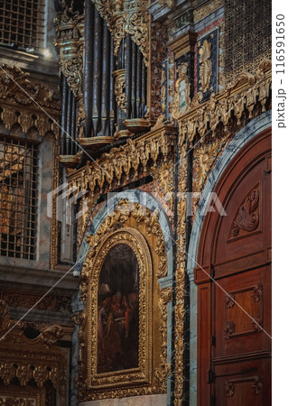 The church features a door and a painting hanging on the wall 116591650