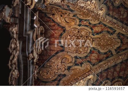 Ceiling with detailed carvings in wood and metal, creating a visual masterpiece Ceiling with detailed carvings in wood and metal, creating a visual masterpiece 116591657