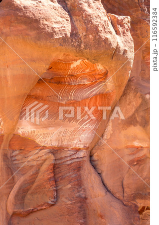 Sandstone rock and mineral layers in Petra, Jordan Sandstone rock and mineral layers in Petra, Jordan 116592384