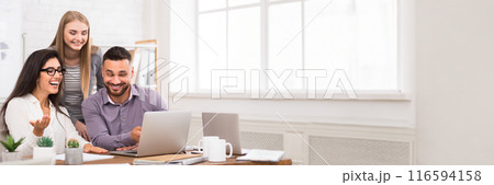 Satisfied business team working on laptop together, having good news, copy space. Teamwork, collaboration concept Satisfied business team working on laptop together, having good news, copy space. Teamwork, collaboration concept 116594158