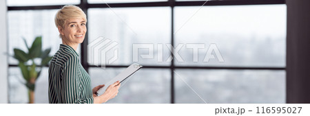 Successful Businesswoman Holding Folder Standing Near Window In Modern Office. Selective Focus, Copy Space 116595027