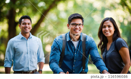 Happy coworkers participating in a team-building activity outdoors, fostering teamwork and camaraderie. 116596086