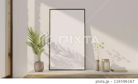 white frame mockup with plant on white wall 116596167
