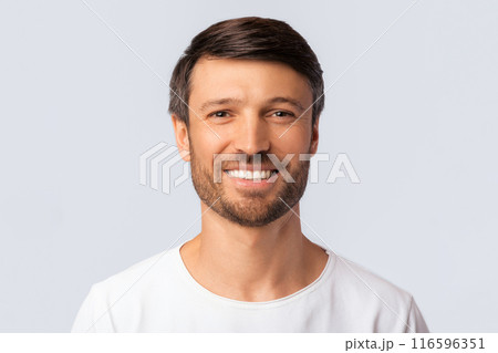 Portrait Of Cheerful Man Smiling At Camera Over White Background In Studio. Isolated Portrait Of Cheerful Man Smiling At Camera Over White Background In Studio. Isolated 116596351