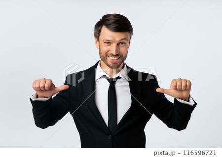 Confidence. Businessman Pointing Thumbs At Himself Over White Background In Studio. Isolated Confidence. Businessman Pointing Thumbs At Himself Over White Background In Studio. Isolated 116596721