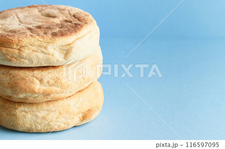 Bolo de caco. Traditional portuguese bread on blue a background 116597095