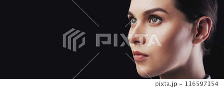 Portrait Of Female Face Staring Aside Over Black Studio Background. Robot And Human Cloning. Closeup Portrait Of Female Face Staring Aside Over Black Studio Background. Robot And Human Cloning. Closeup 116597154